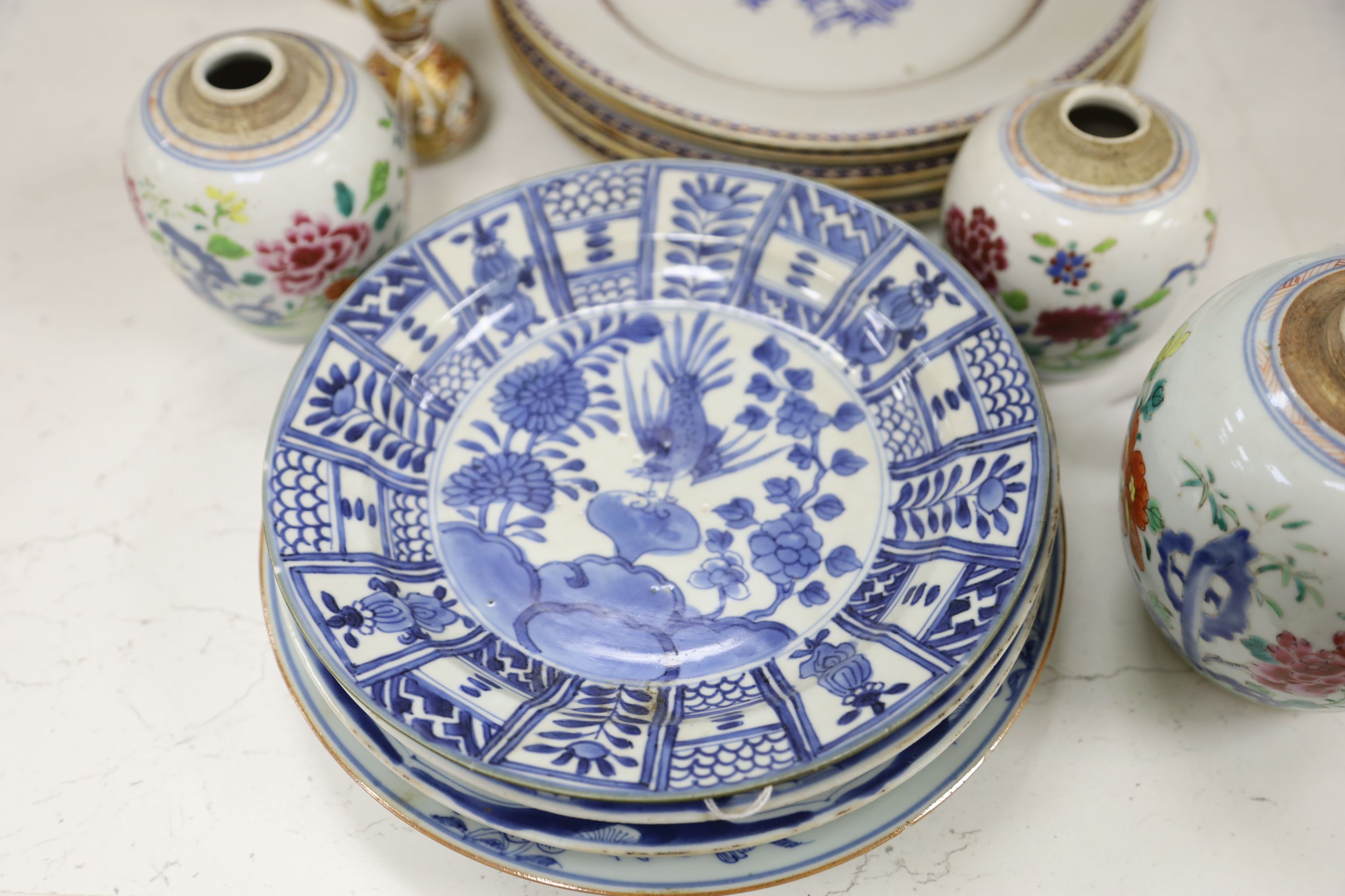 A collection of mixed Asian ceramics, including various Chinese blue and white export plates,